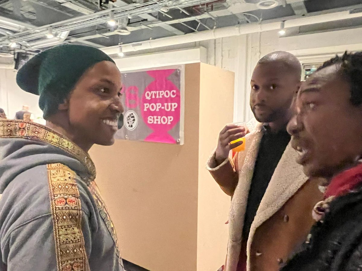 Members in conversation at a QTIPOC pop-up